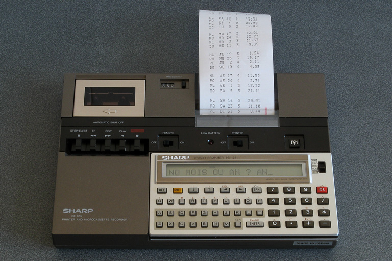 Photo of a Sharp PC-1251 running a moon phase calculation program