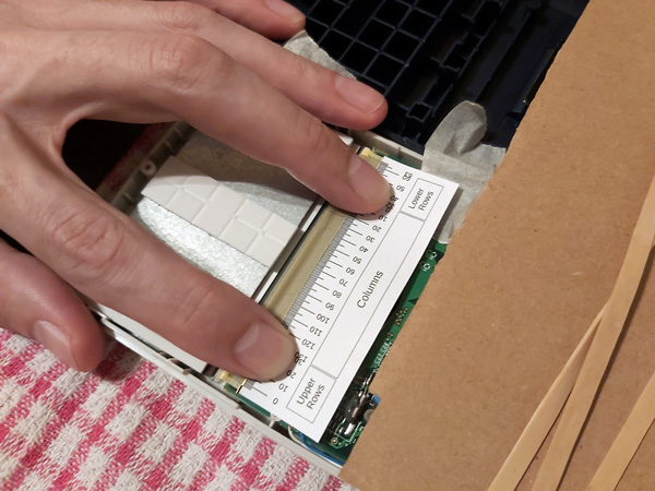 Photo of locating the areas on the flex cable inside the calculator to heat